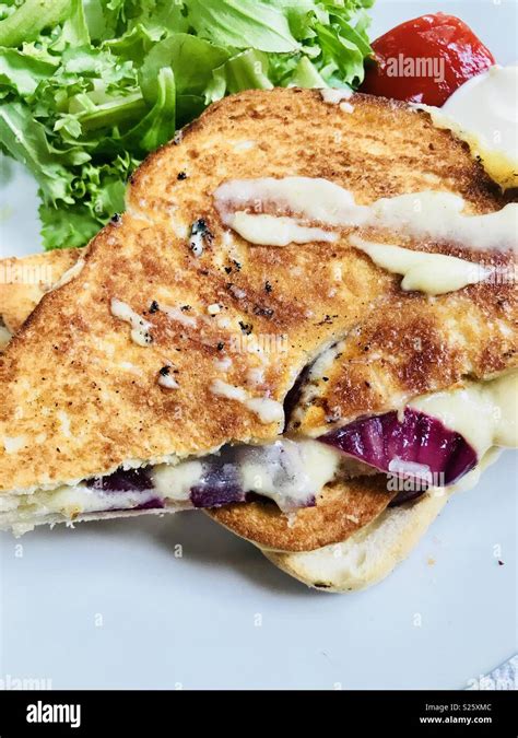 Cheese and red onion toastie Stock Photo - Alamy