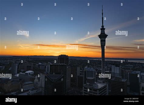 Auckland Skyline at Sunset showing Sky Tower Stock Photo - Alamy