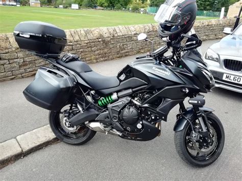 Black Motorcycle Parked Next to Silver Car