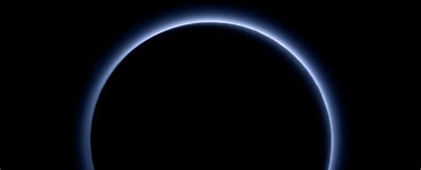 Our First Glimpse at The Colour of Pluto's Atmosphere Reveals Blue Skies, Red Ice : ScienceAlert