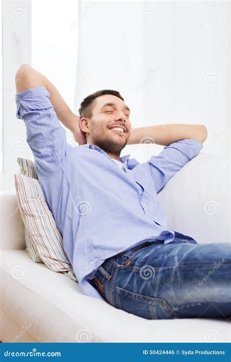 Smiling Man Relaxing on Couch at Home Stock Photo - Image of leisure, dreaming: 50424446