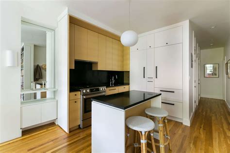 Tall Kitchen Pantry Cabinets Create a Full Wall Effect | Sweeten