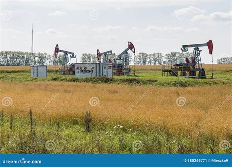 Oil pumpjack in the field editorial photo. Image of extraction - 180246771