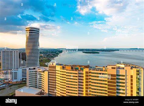 Urban skyline of Guayaquil city and its skyscrapers by the river Guayas at sunset, Ecuador Stock ...