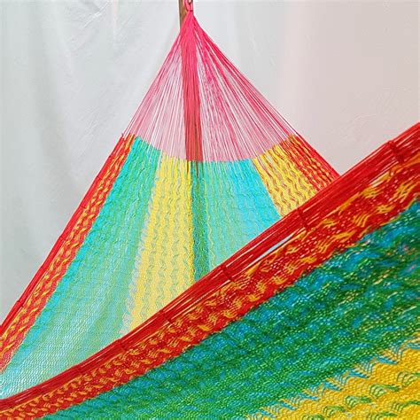 Single hammock hand made in Mexico. Comes in a tropical color design.