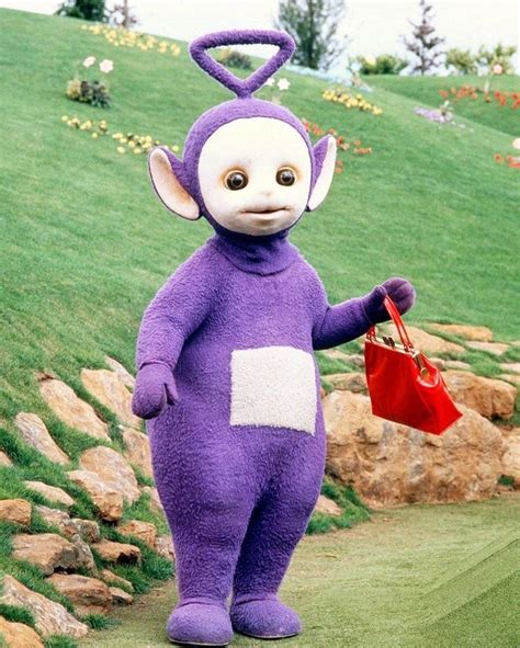 “Tinky Winky, the tallest Teletubby (10 feet/304cm), holding his red ...