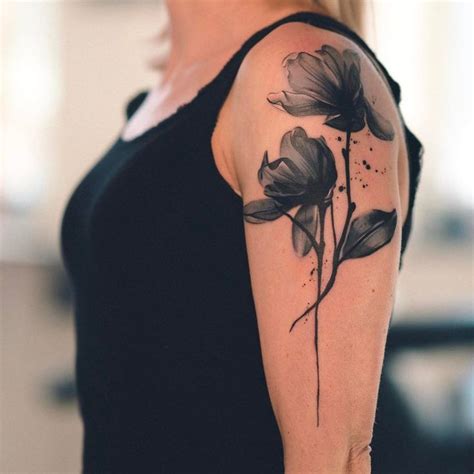 Watercolor tattoo - Black watercolor flower tattoo on the left upper arm - TattooViral.com ...