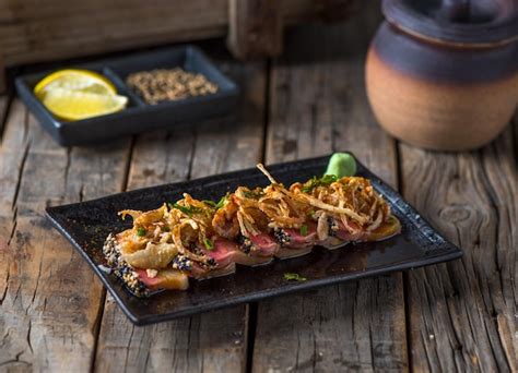 Premium Photo | Hamachi tataki served in a dish isolated on wooden background side view of ...