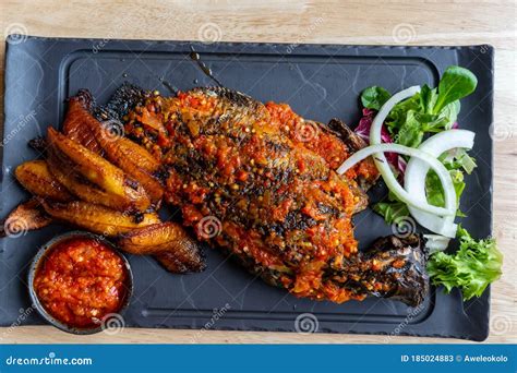 Nigerian Food: Delicious Roasted Fish and Fried Plantain Stock Image ...