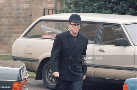 Elton John, at Freddie Mercury's funeral at West London Crematorium ...