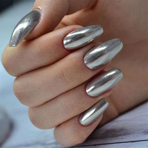 Silver Chrome Mirrored Effect Nails - NOTD Today's nail art has a very high couture feel to it ...