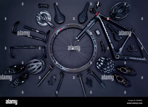 Road bike parts and accessories on a black background Stock Photo - Alamy