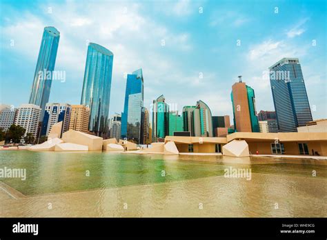 Abu Dhabi skyline at sunset. Abu Dhabi is the capital and the second ...