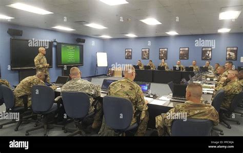 Sgt. 1st Class Dominic Schroeder, senior instructor, gives a welcome brief to a group of U.S ...