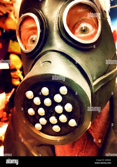 Man looking out of a Halloween costume gas mask, USA Stock Photo - Alamy