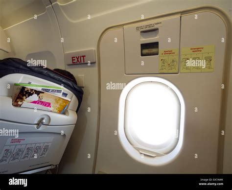 Airplane emergency exit door Stock Photo - Alamy