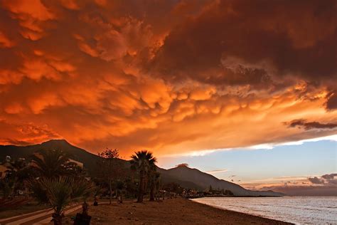 Mammatus clouds forming at sunset ahead of severe thunderstorm Photograph by Ken Biggs - Fine ...