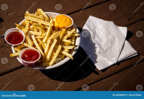 French Fries with Ketchup and Cheese Stock Photo - Image of unhealthy, yellow: 68428810