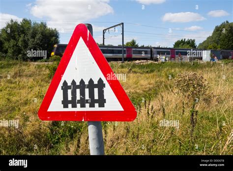 level crossing sign railway Unmanned with train Stock Photo - Alamy