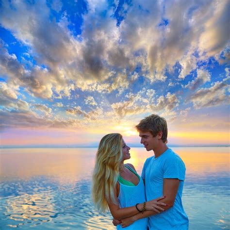 Premium Photo | Blond young couple hug in sunset sea lake happy