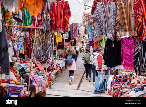 Peru market, Sunday market at town of Pisac, vendors, locals, tourists at the city of Pisac ...