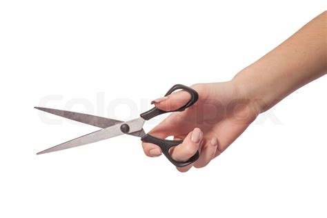 Hand is holding scissors isolated | Stock image | Colourbox