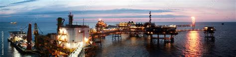 Offshore oil rig at sunset Stock Photo | Adobe Stock