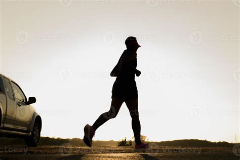 The silhouette of a man running at sunset 14012407 Stock Photo at Vecteezy