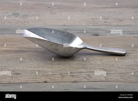 Measuring shovel on wood Stock Photo - Alamy