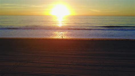 Aerial drone uav view of a sunset over the beach and ocean. 2636982 Stock Video at Vecteezy