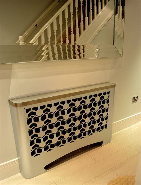 Modern hallway radiator cover in geometric CUBIC design – laser cut screens for architectural ...