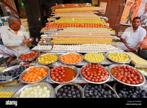 Vendors in shop with sweets during Diwali festival, Bharatpur ...