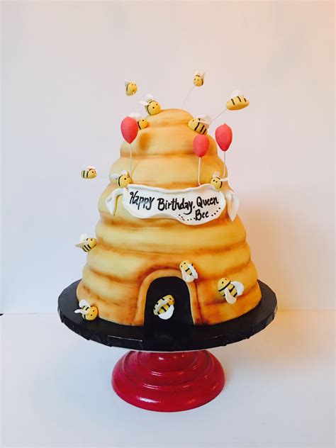 Beehive honey bee cake! This beehive is made of stacked cakes layered with chocolate buttercream ...