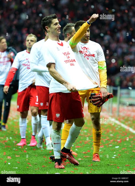 Poland's Robert Lewandowski leads the Poland players on a victory lap ...