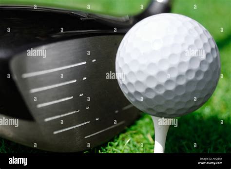 Close up of wood and golf ball on tee Stock Photo - Alamy