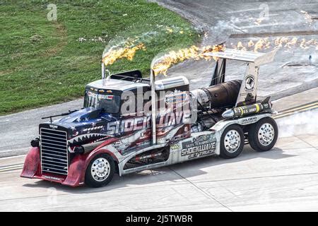 Shockwave Jet Truck racing down runway with vapor trail Stock Photo - Alamy