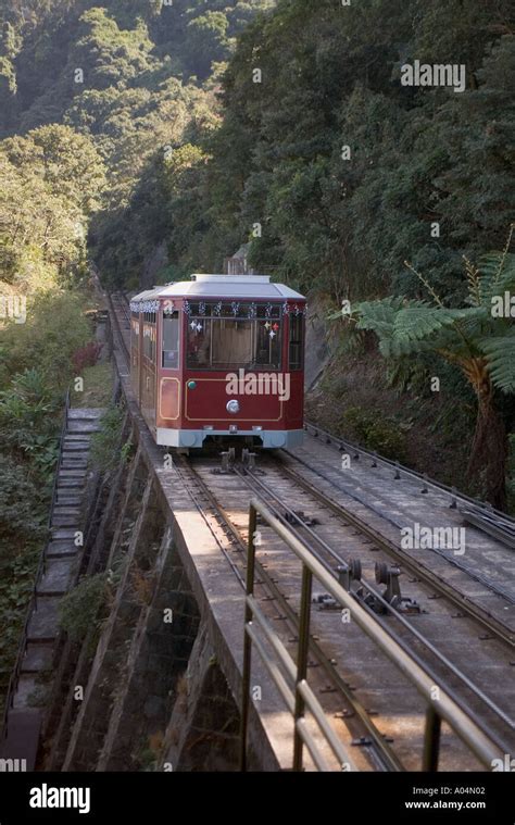 dh Peak Tram VICTORIA PEAK HONG KONG Tram climbing arriving Barker Road station Stock Photo - Alamy