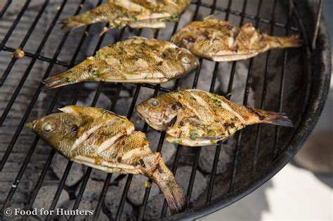 Grilled whole bluegill that were marinated in a garlic, lime sauce.