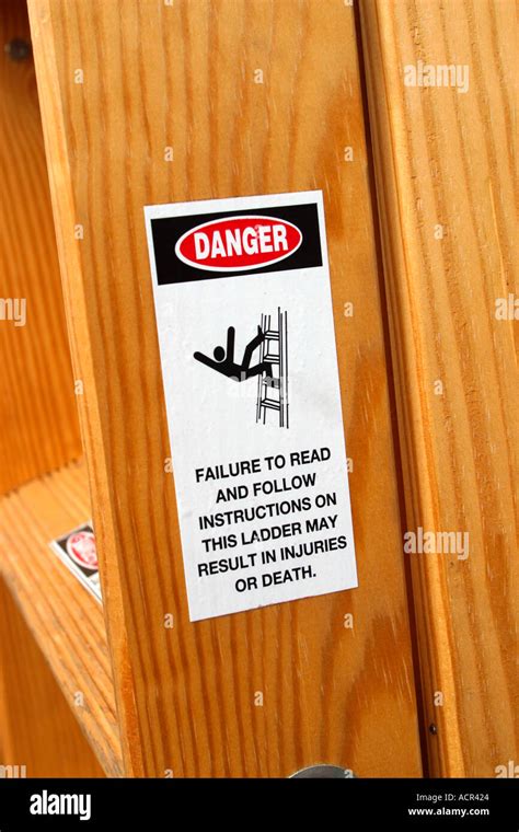 Warning Label on Ladder Stock Photo - Alamy