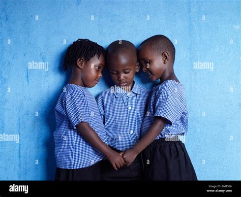 Three African children holding hands after the Rwandan genocide Stock Photo - Alamy