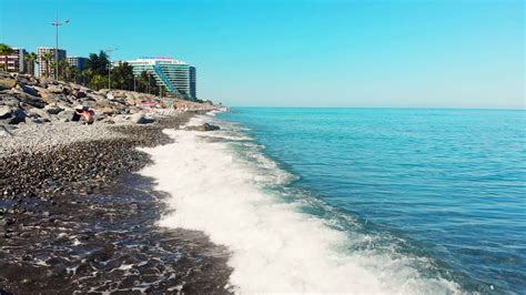 Aerial panoramic view of beautiful Batumi beach in sunny summer weather. Batumi is capital of ...