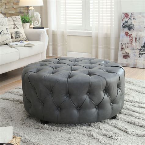 Simplify, beautify and amplify your living space with this gorgeous button tufted round ottoman ...