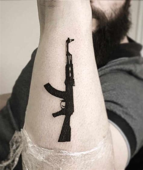 Pin on 25 of the Best Gun Tattoos