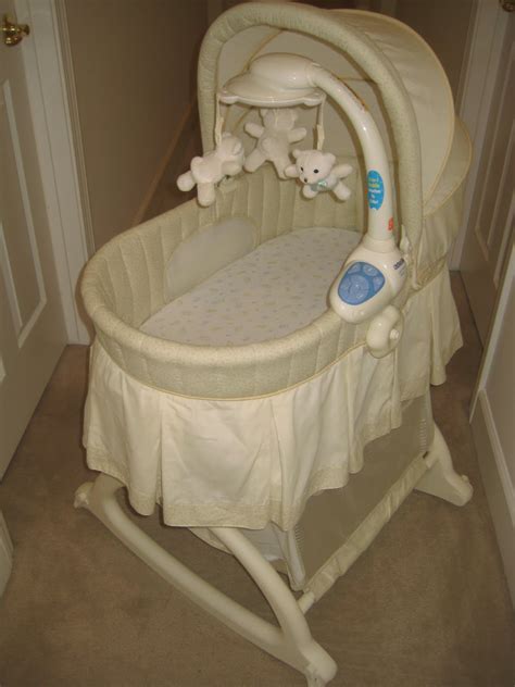 Kid's Clothes and More Store: Kolcraft Cuddle 'n Care Rocking Bassinet with Light Vibes Mobile $50