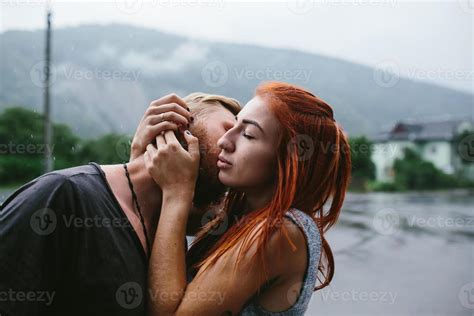 beautiful couple hugging in the rain 11369655 Stock Photo at Vecteezy