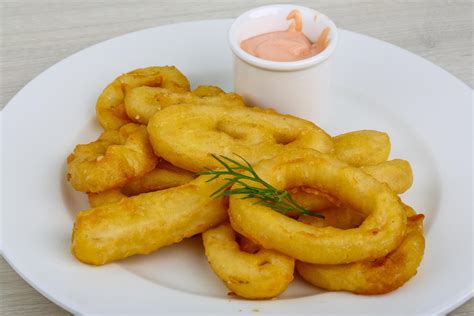 Fried calamari rings 12284594 Stock Photo at Vecteezy