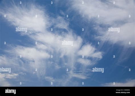 Blue sky with 'jellyfish' clouds Stock Photo - Alamy