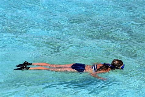 Woman Snorkeling in Lagoon at Half Moon Cay, The Bahamas - Encircle Photos