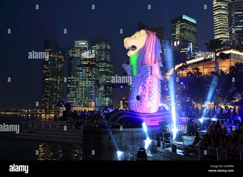 Merlion Statue lit up at night during the Merlion statue 40th birthday celebrations in Marina ...