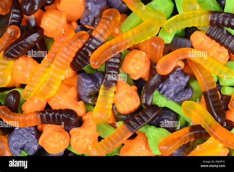 macro halloween gummy worms witches brooms cats candy Stock Photo - Alamy